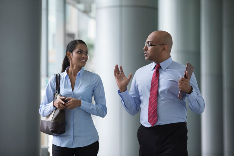 Photo of a woman and a man conversing