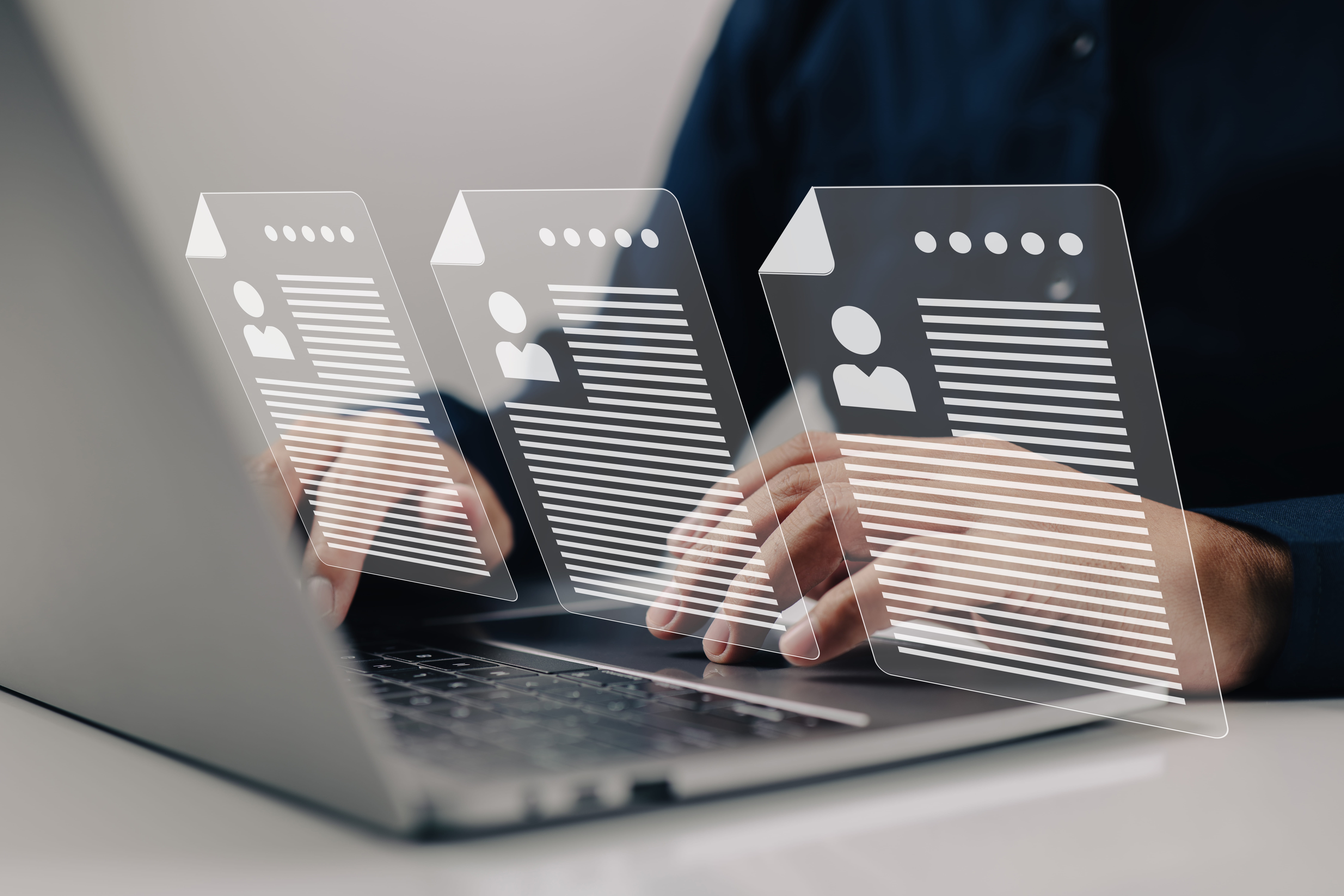 Employer reviewing candidate profiles online to support fair recruitment and hiring practices in Singapore.