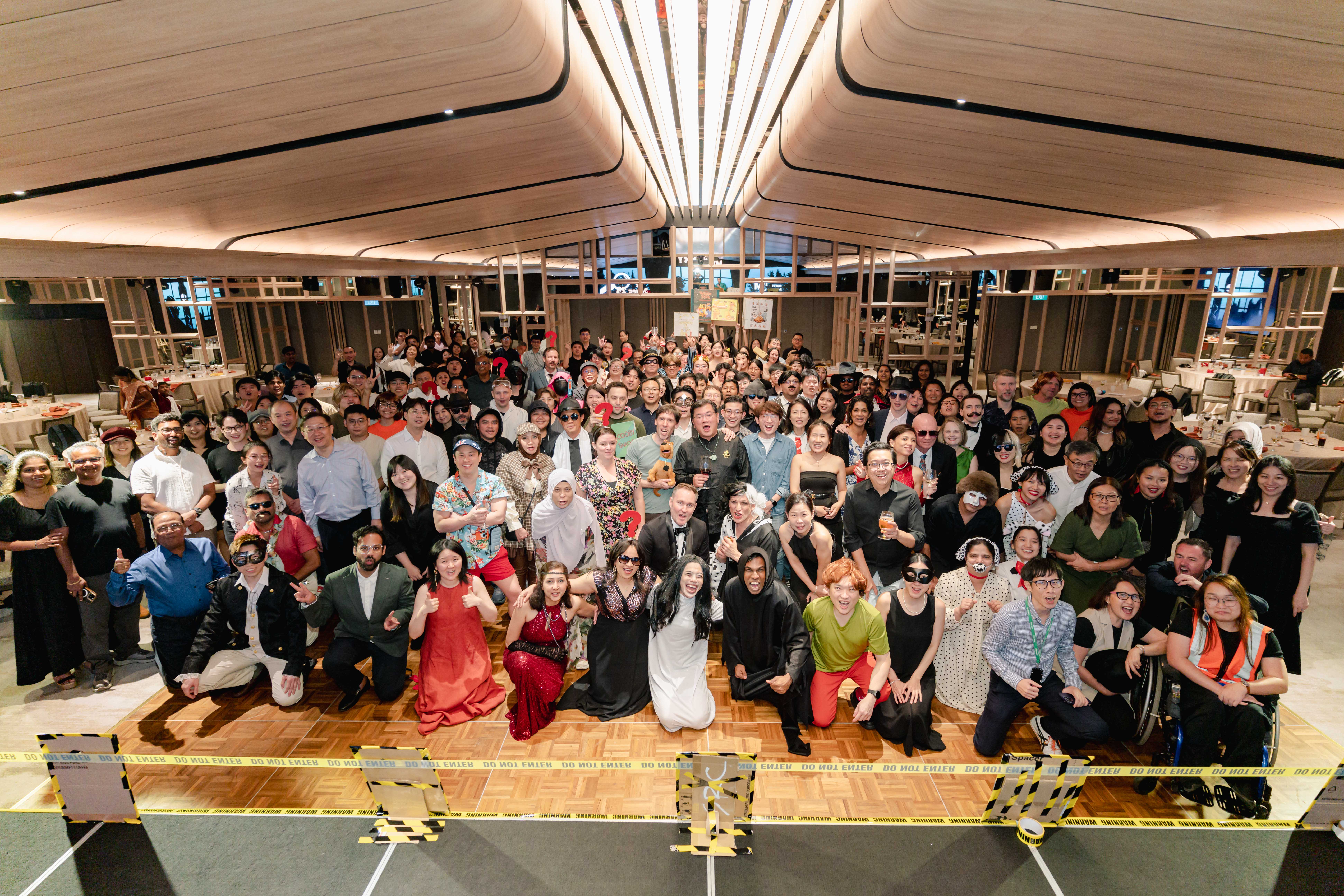 Group photo of Mott MacDonald employees gathered in an indoor event space.